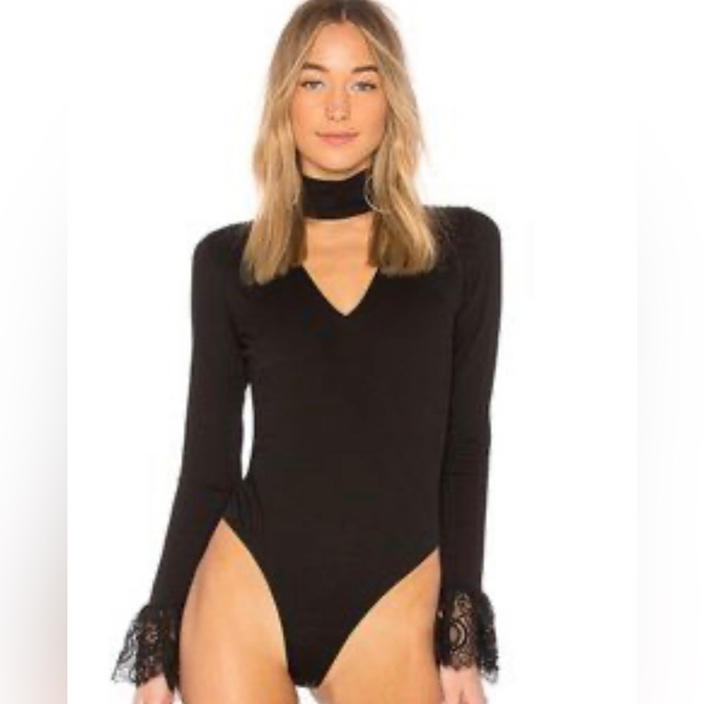 Black long sleeve bodysuit in size small from cinq a sept.